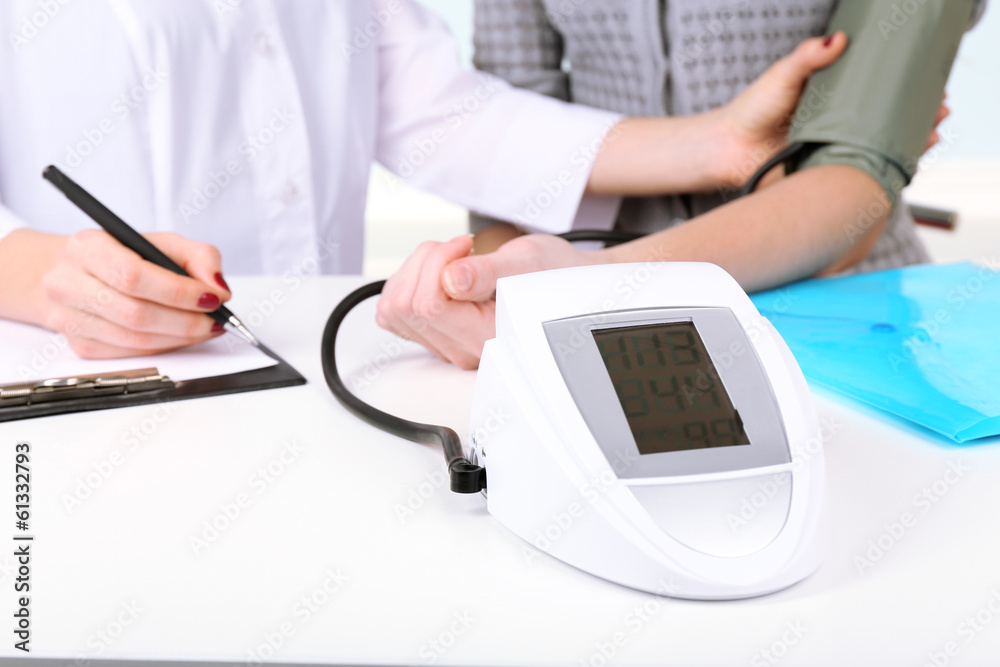 Measuring pressure of patient in hospital close-up Measuring pressure of patient in hospital close-up