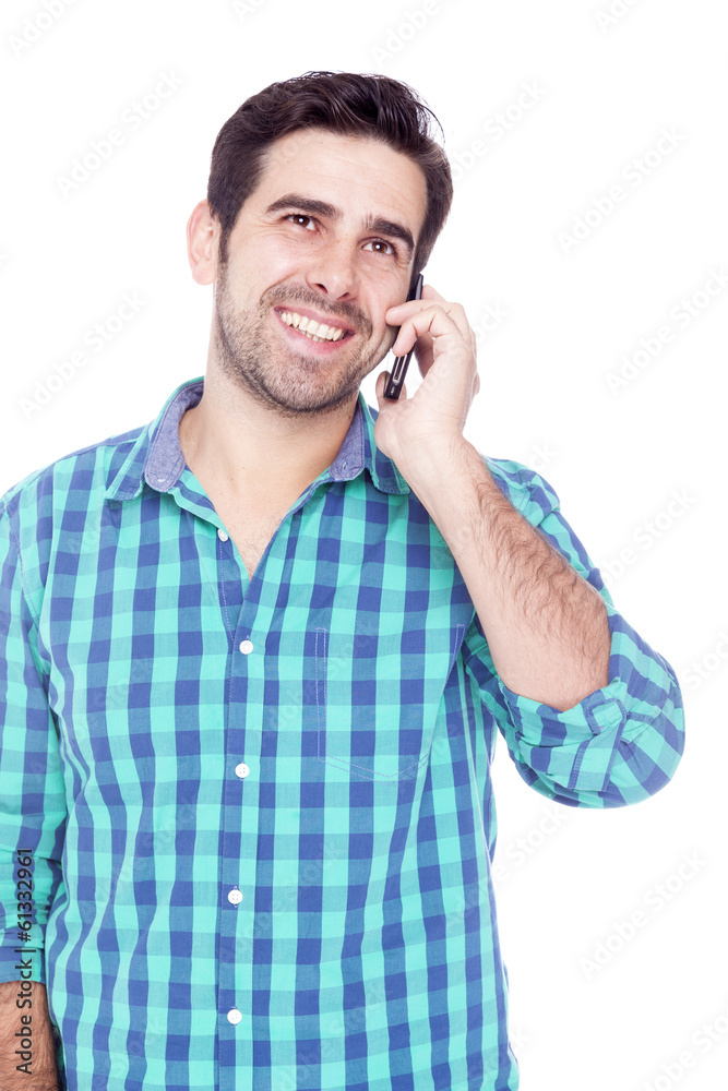 Handsome man talking on cell phone, isolated on a white backgrou Handsome man talking on cell phone, isolated on a white backgrou