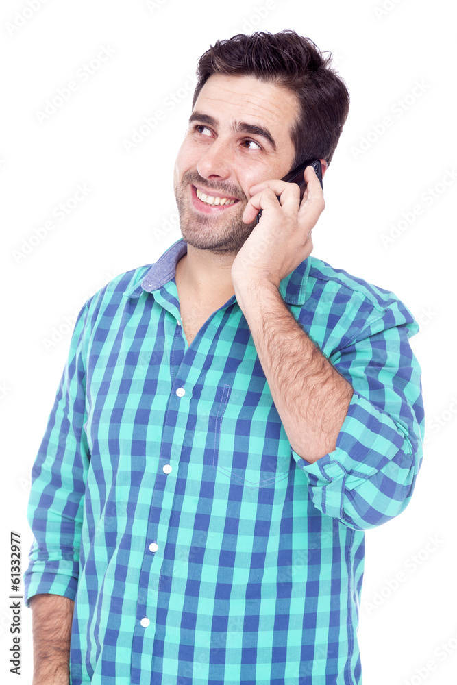 Handsome man talking on cell phone, isolated on a white backgrou Handsome man talking on cell phone, isolated on a white backgrou