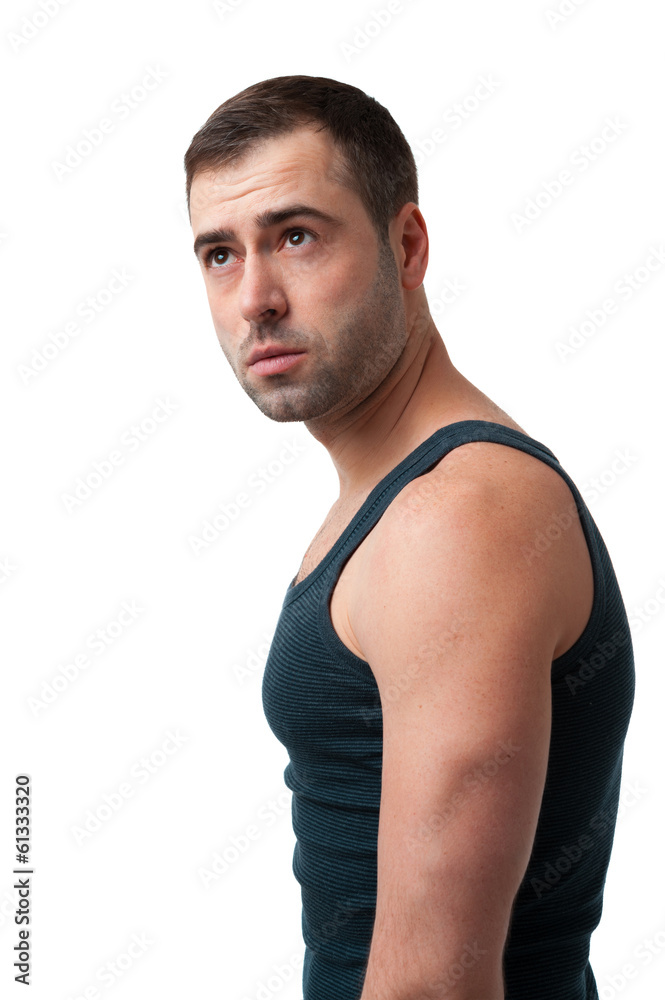 Mature man in t-shirt looking up on white background Mature man in t-shirt looking up on white background