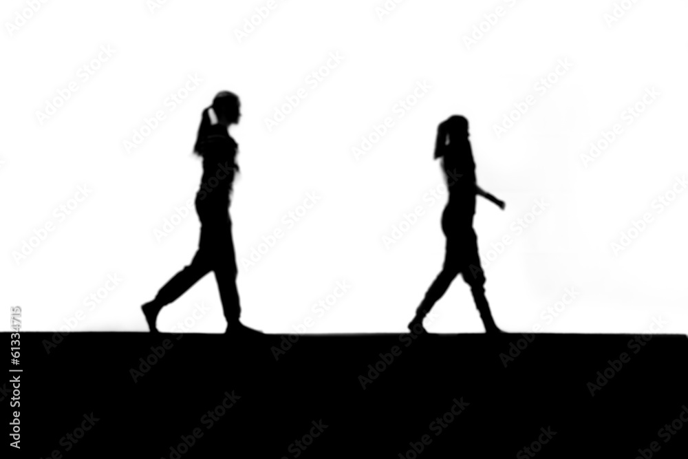 two blurred female teenager in background two blurred female teenager in background