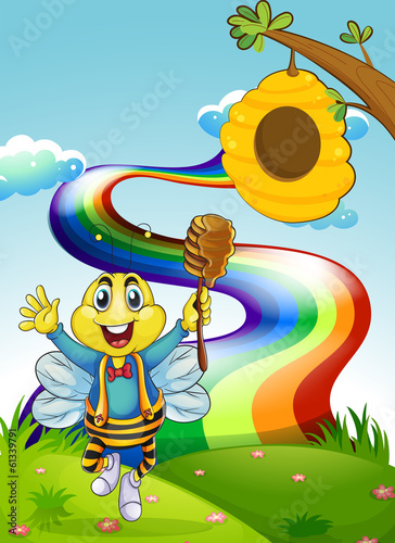 A happy bee at the hilltop with a rainbow