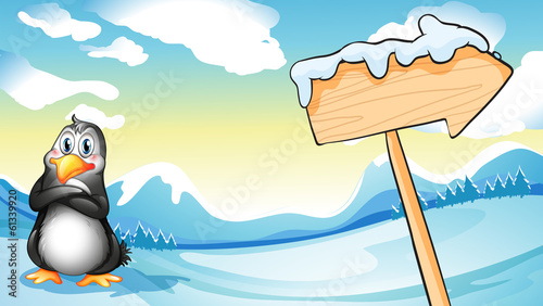 A penguin beside the empty arrowboard
