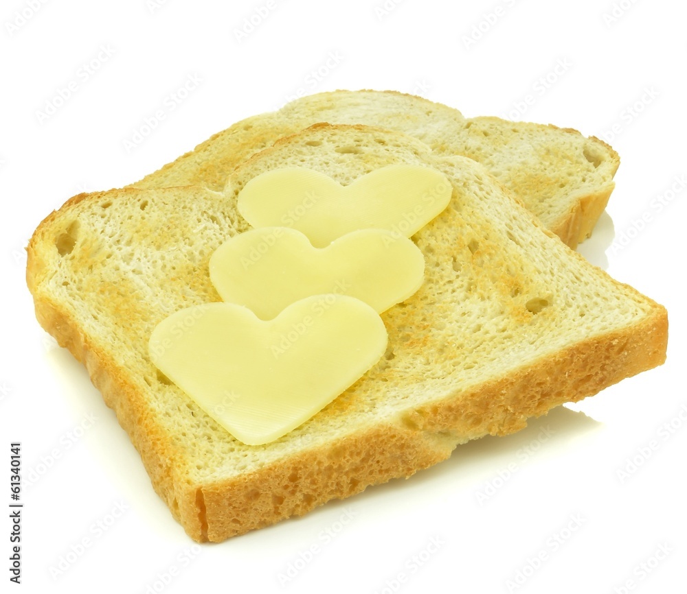 Toast with heart shaped cheese slices on white background Toast with heart shaped cheese slices on white background