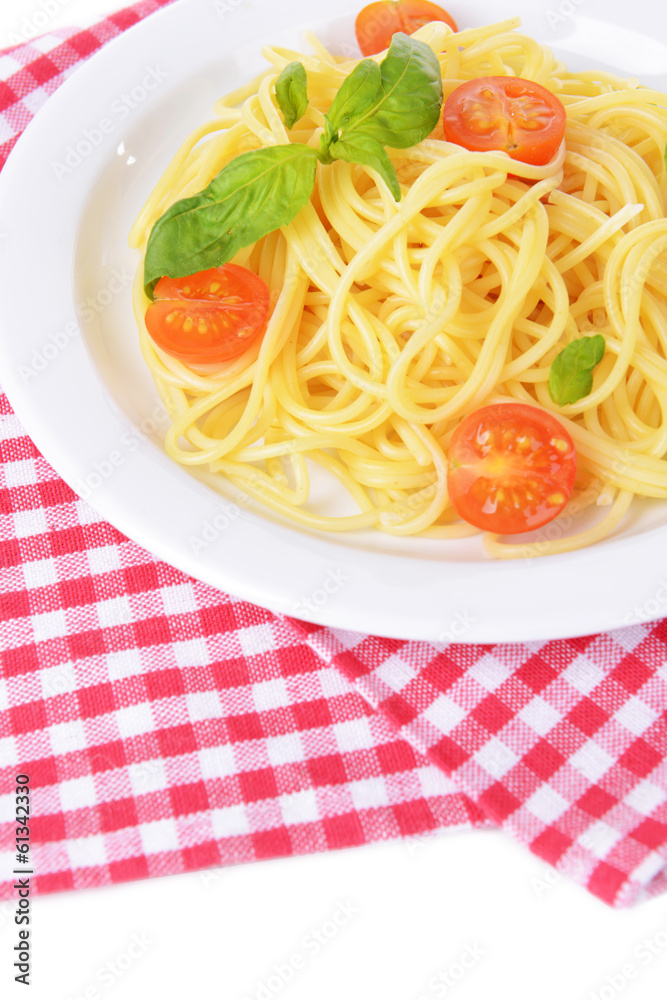 Delicious spaghetti with tomatoes on plate on table close-up Delicious spaghetti with tomatoes on plate on table close-up