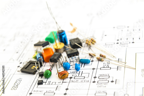 electronic components on a schematic diagram background. photo