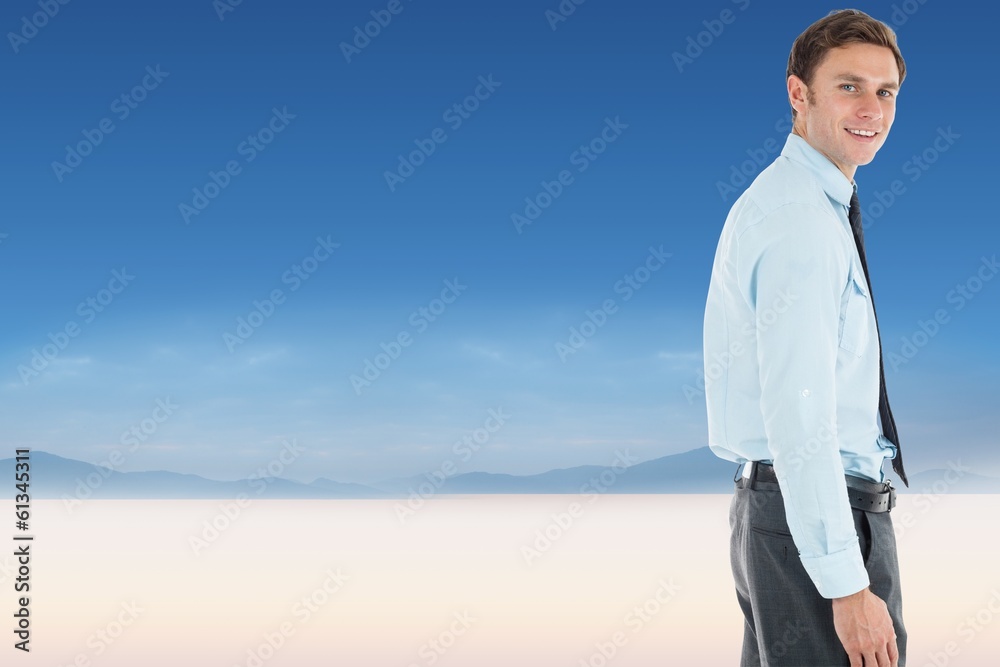 Composite image of happy businessman standing with hand in Composite image of happy businessman standing with hand in