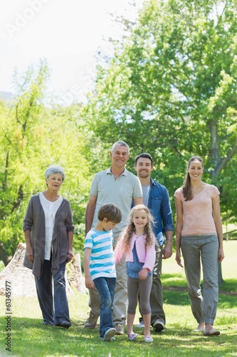 Happy extended family walking in park © WavebreakmediaMicro