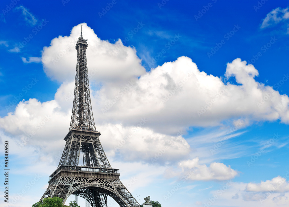 Eiffel Tower against cloudy blue sky