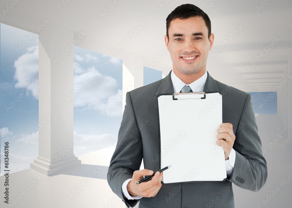 Composite image of businessman pointing with pen on clipboard Composite image of businessman pointing with pen on clipboard