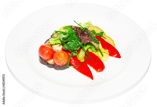 Vegetable salad pepper tomato onion lettuce and rocket on