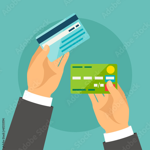 Hands holding bank cards in flat design style.