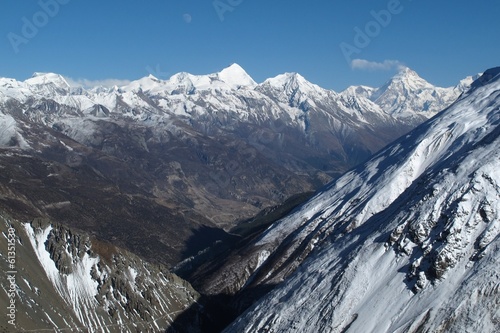 View of Pisang Peak and other snow capped mountains near Manang