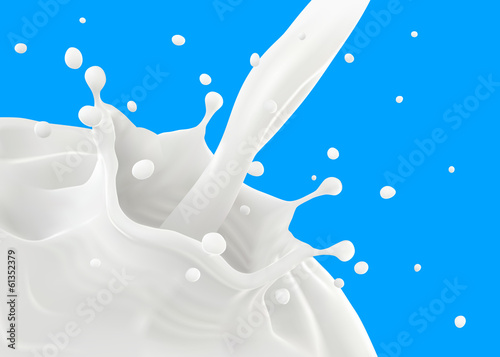 Pouring milk, making ripples and splashing on blue background.