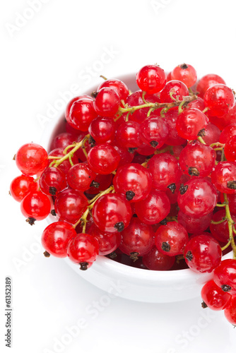bowl of red currant isolated on white, top view, close-up
