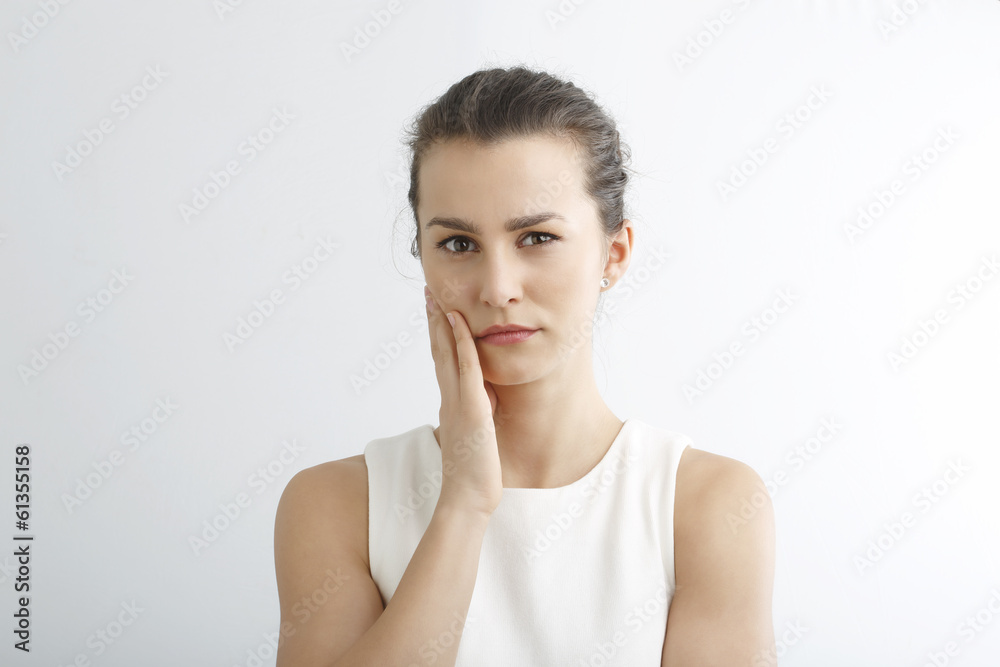Stressed young woman portrait against white background. Stressed young woman portrait against white background.