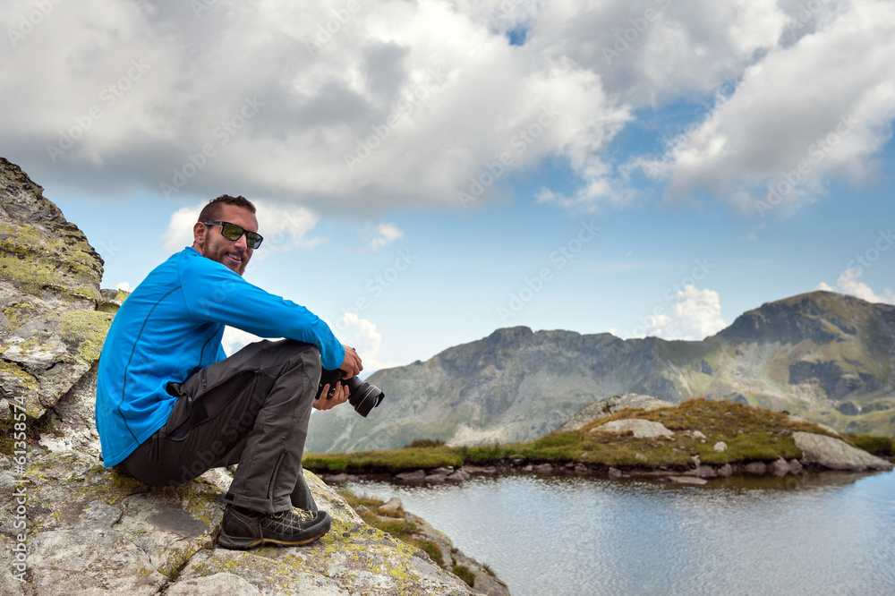 Smiling man portrait with camera outdoor in the mountains. Alps, Smiling man portrait with camera outdoor in the mountains. Alps,