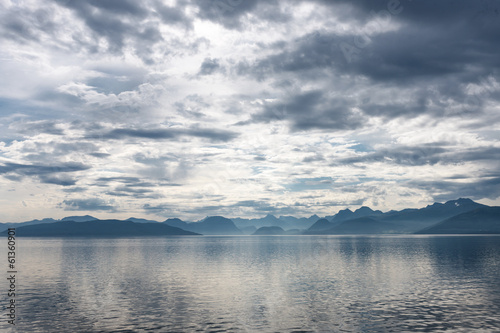 Fjord scene with dramatic cloudy sky