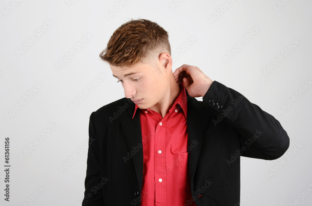 Stressed an unhappy young business man looking down. Stressed an unhappy young business man looking down.