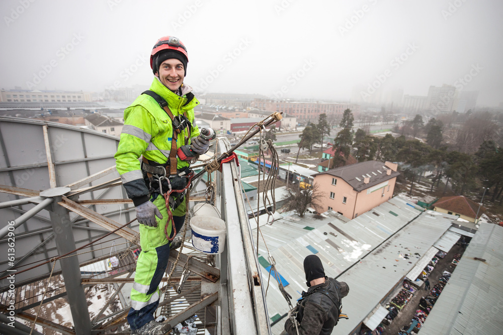 Industrial climber on top of a metal construction