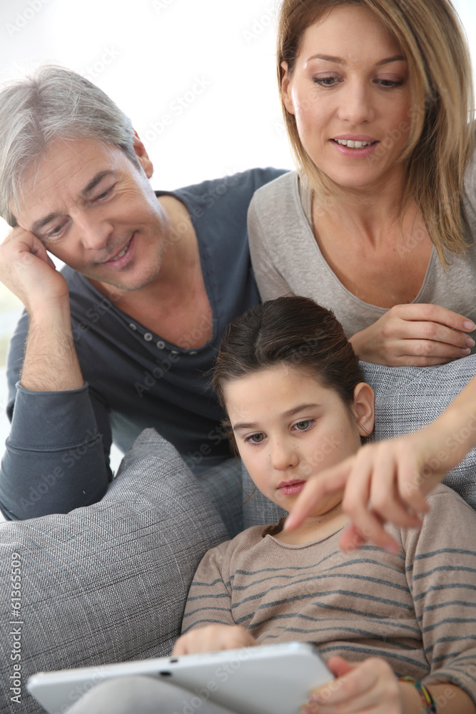 Parents websurfing on internet with daughter Parents websurfing on internet with daughter