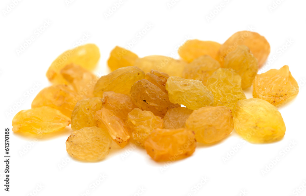yellow raisins on a white background. macro yellow raisins on a white background. macro