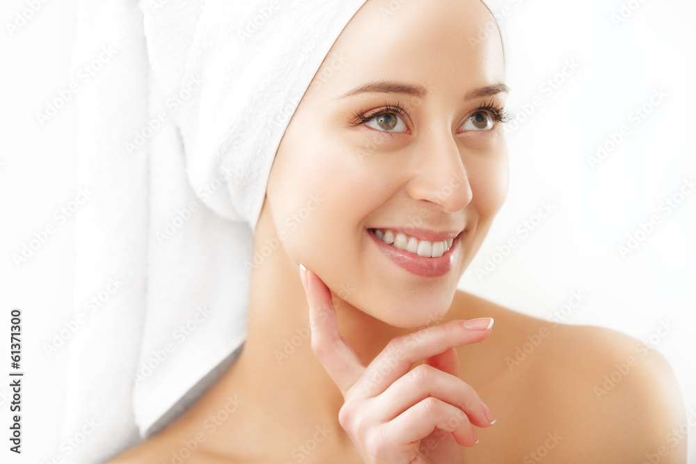 Portrait of beautiful woman applying cream on face - isolated Portrait of beautiful woman applying cream on face - isolated