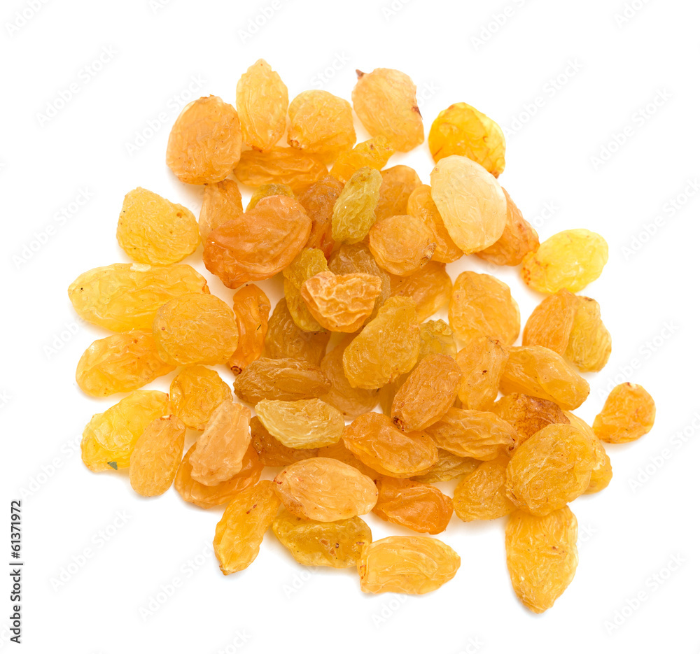 yellow raisins on a white background. macro yellow raisins on a white background. macro