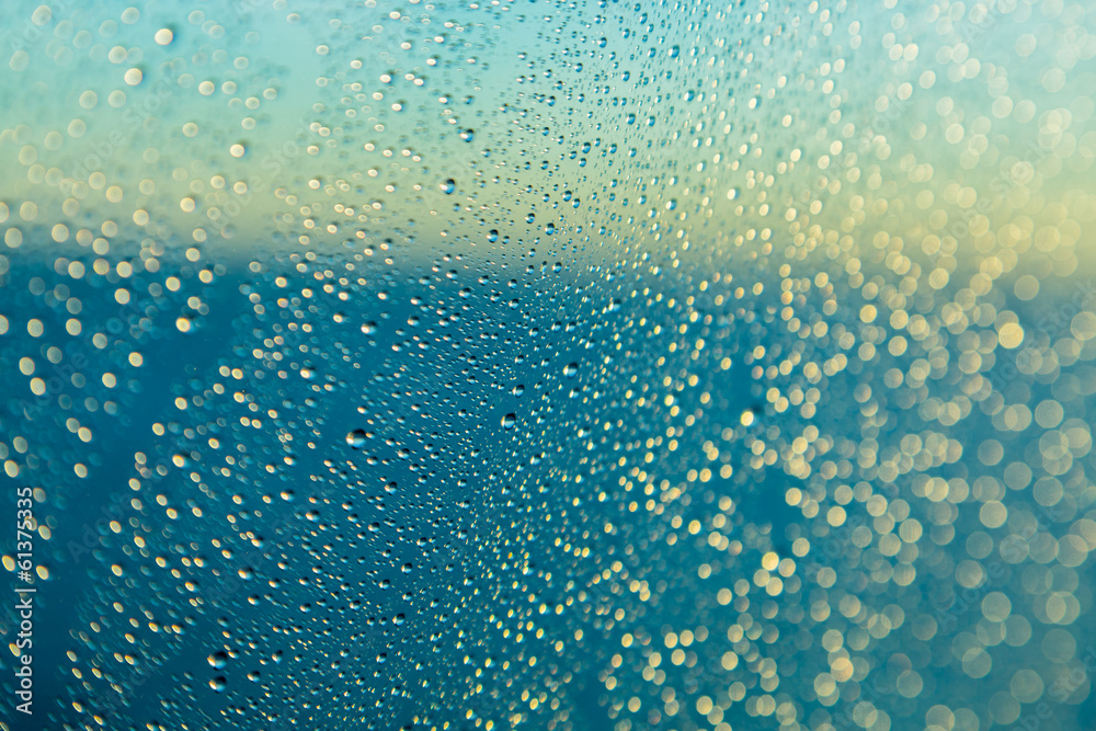 Raindrops on window of a ship at sea with horizon Raindrops on window of a ship at sea with horizon