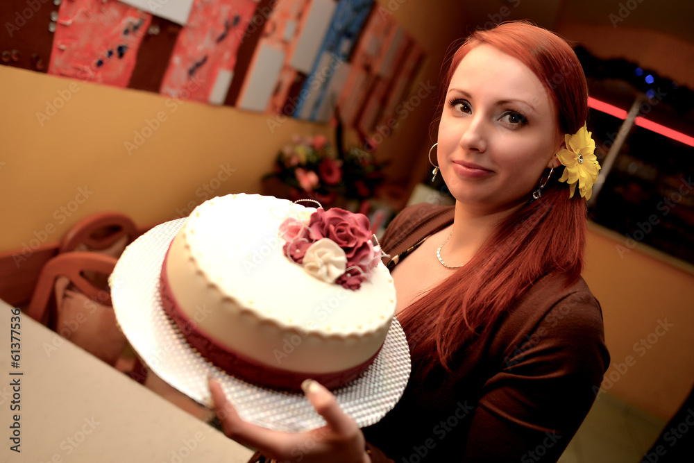Cheerful woman holding birthday cake Cheerful woman holding birthday cake