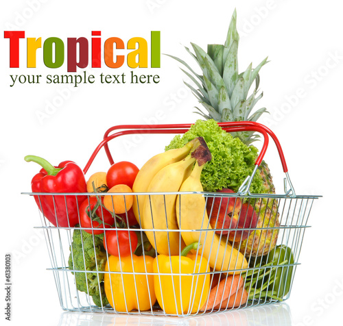 Assortment of fresh fruits and vegetables in metal basket,