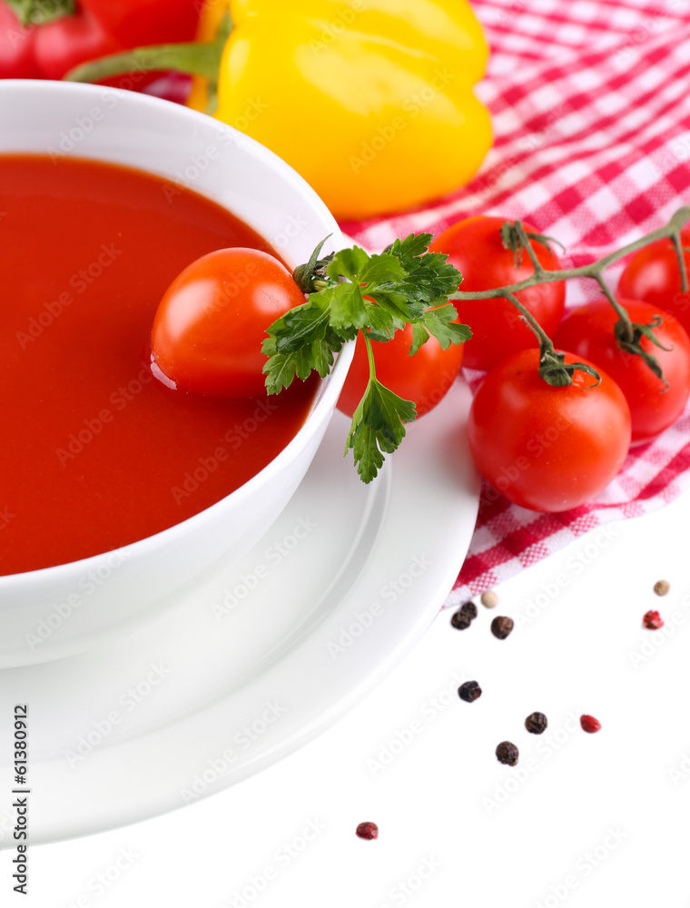 Tasty tomato soup and vegetables, isolated on white Tasty tomato soup and vegetables, isolated on white