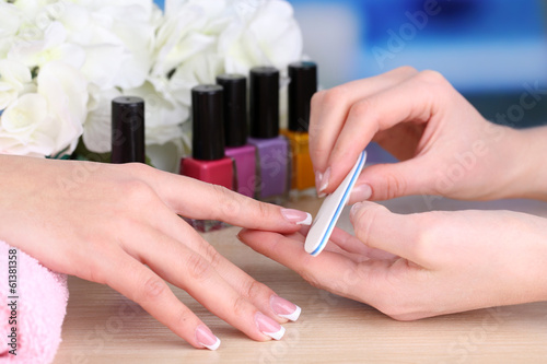 Manicure process in beauty salon close up