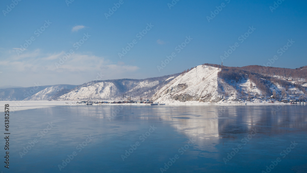Mountains in the reflection on the shore of Lake Baikal.