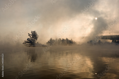 Bridge over the river in a fog