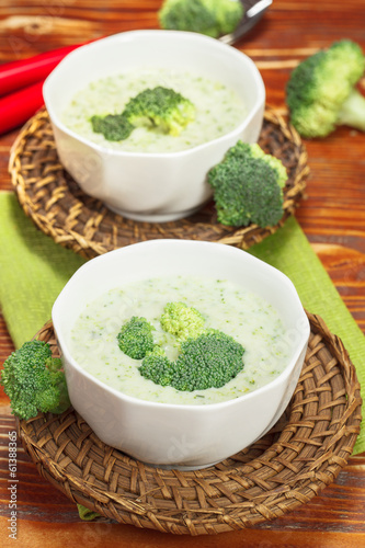 Sopu. Broccoli cream soup and ingredients on table photo