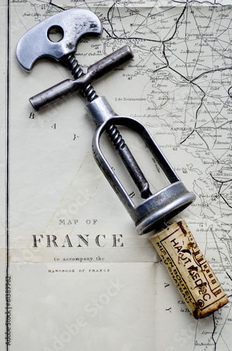 antique corkscrew with Haut medoc cork and a vintage map