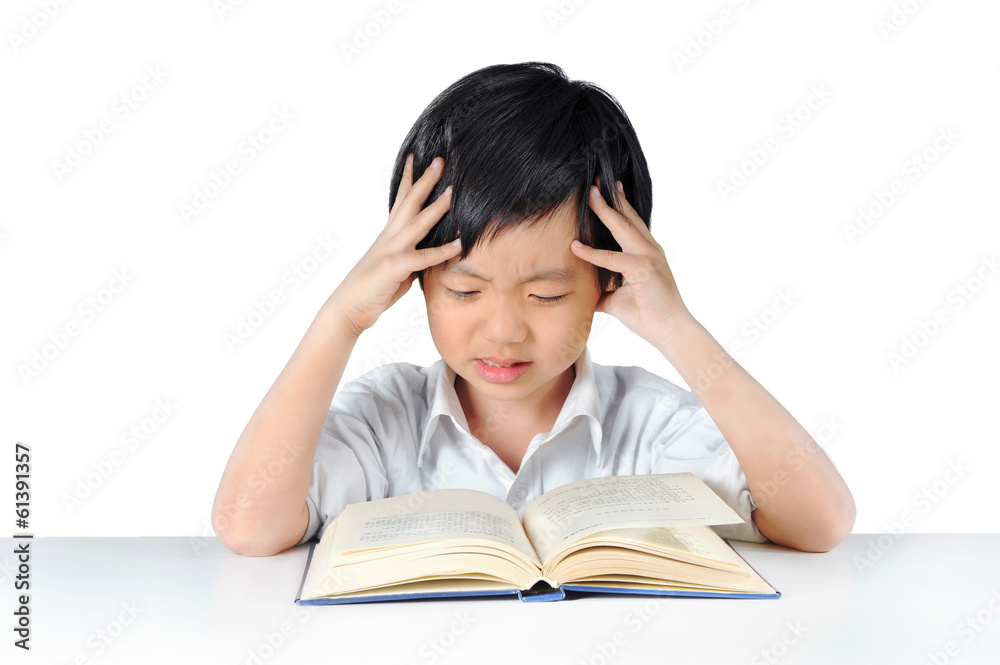Asian boy getting headache from doing homework