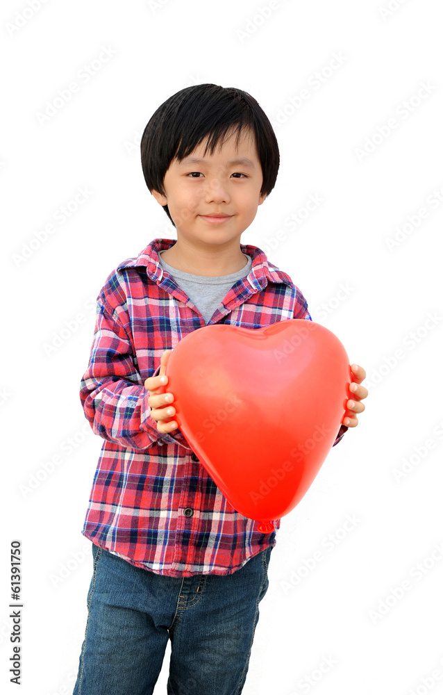 Smiling Chinese boy holding a red heart, isolated on white Smiling Chinese boy holding a red heart, isolated on white