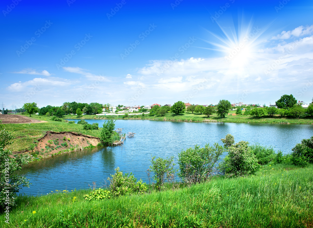 Sun over river