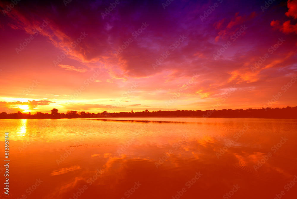 Reflection in the Water of the Pond of Sunset.  Amazing  Orange Evening  Lake Horizon Sky Vivid  Violet  Sunny
