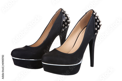 Black platform shoes with studs, isolated on white