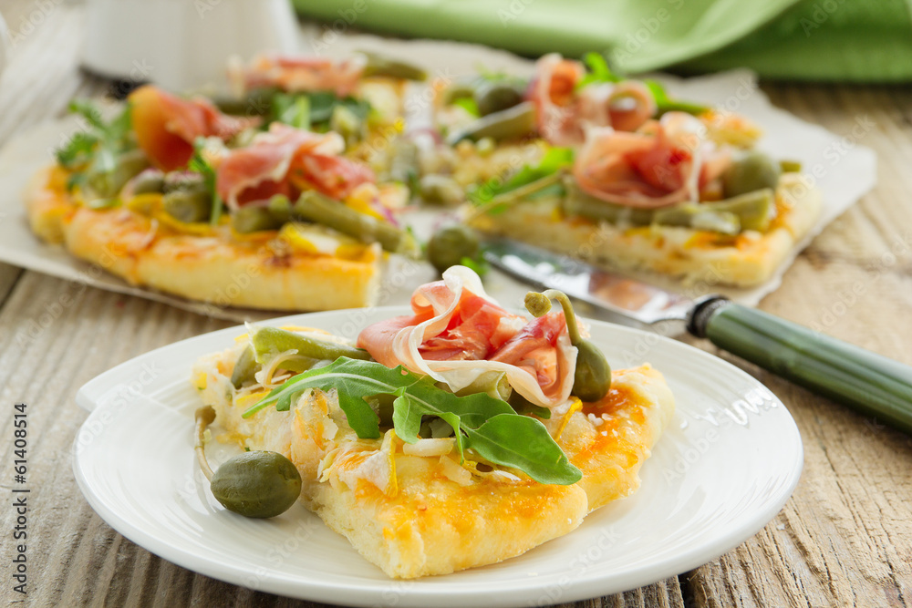 Pizza with arugula and prosciutto. Pizza with arugula and prosciutto.