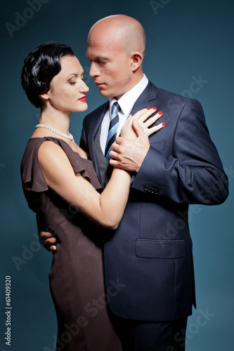 Adult couple of lovers dancing tango. Bold man