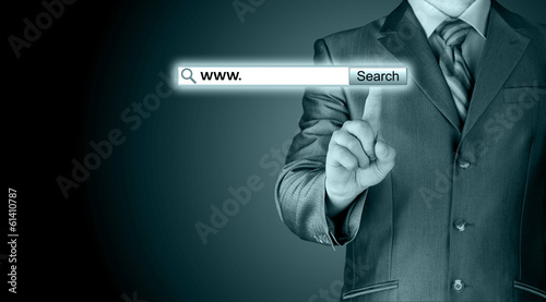 Businessman pushing virtual search bar