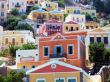 beautiful colorful houses on hill, Symi island, Greece