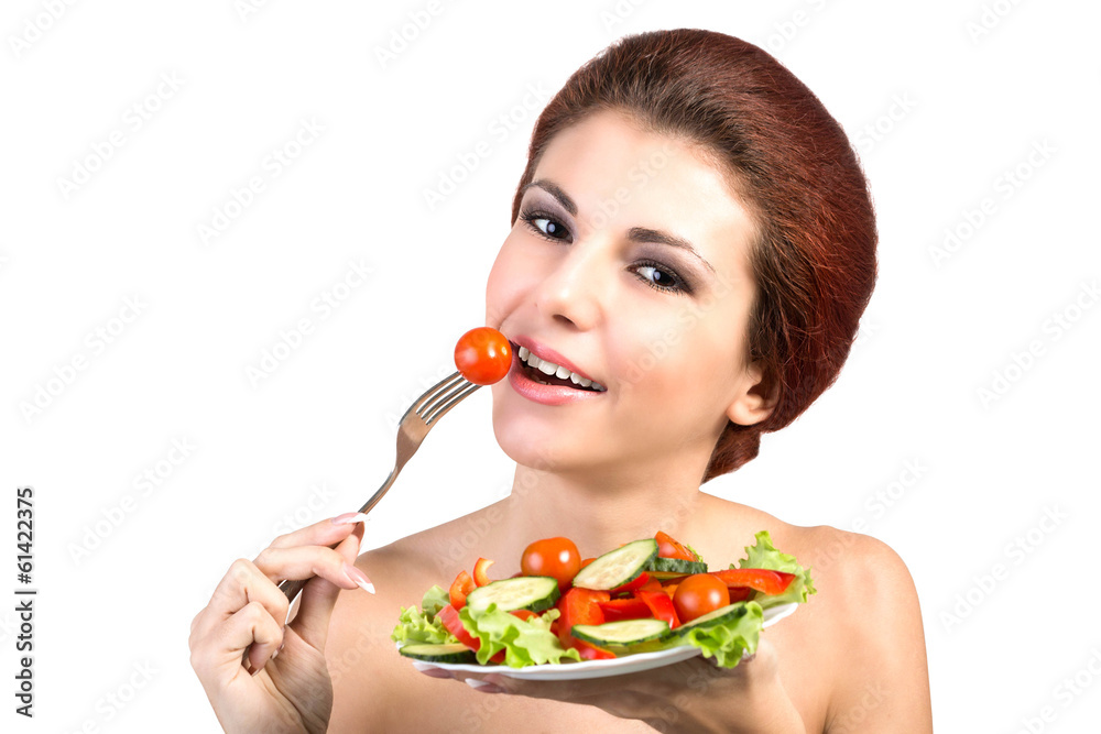 Young Beautiful Girl eating Fresh Vegetables Salad.Vegetarian Young Beautiful Girl eating Fresh Vegetables Salad.Vegetarian