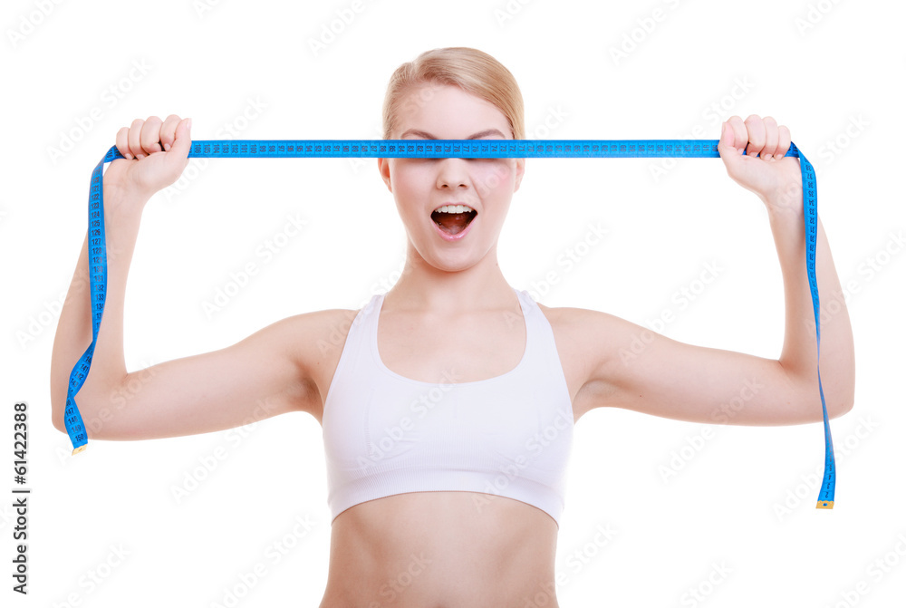 Fitness girl covering her eyes with measuring tape isolated Fitness girl covering her eyes with measuring tape isolated
