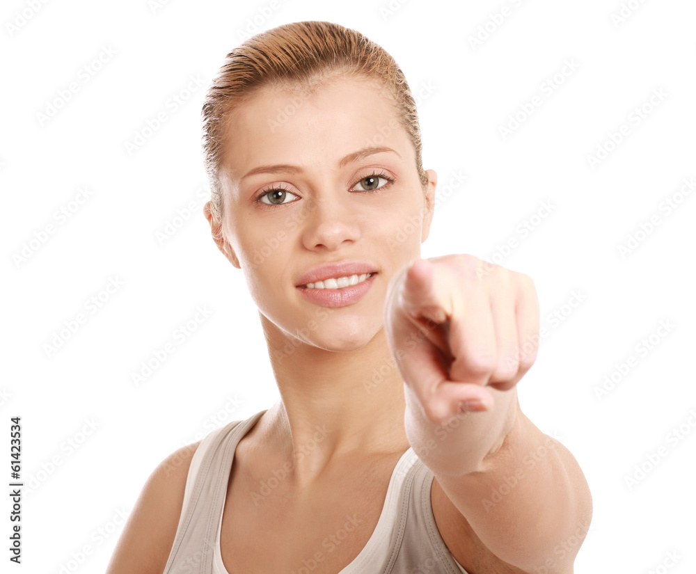Portrait of a beautiful young woman pointing at you Portrait of a beautiful young woman pointing at you
