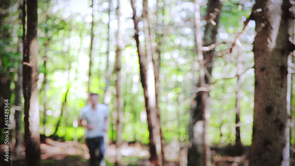 Man running Alone in the forest on a beautiful day Man running Alone in the forest on a beautiful day
